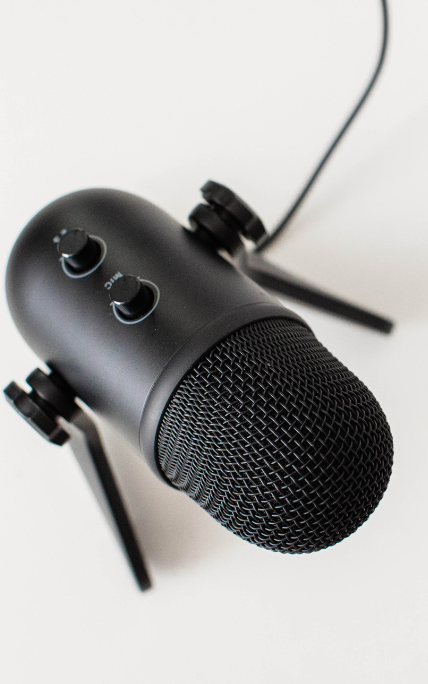 black microphone against white background